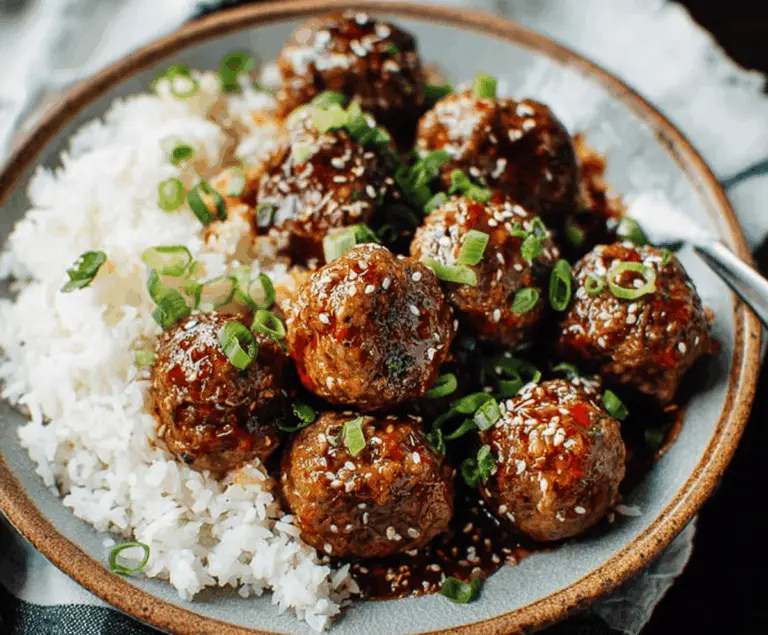 Delicious homemade Mongolian meatballs served with sautéed vegetables and a savory sauce on a rustic plate