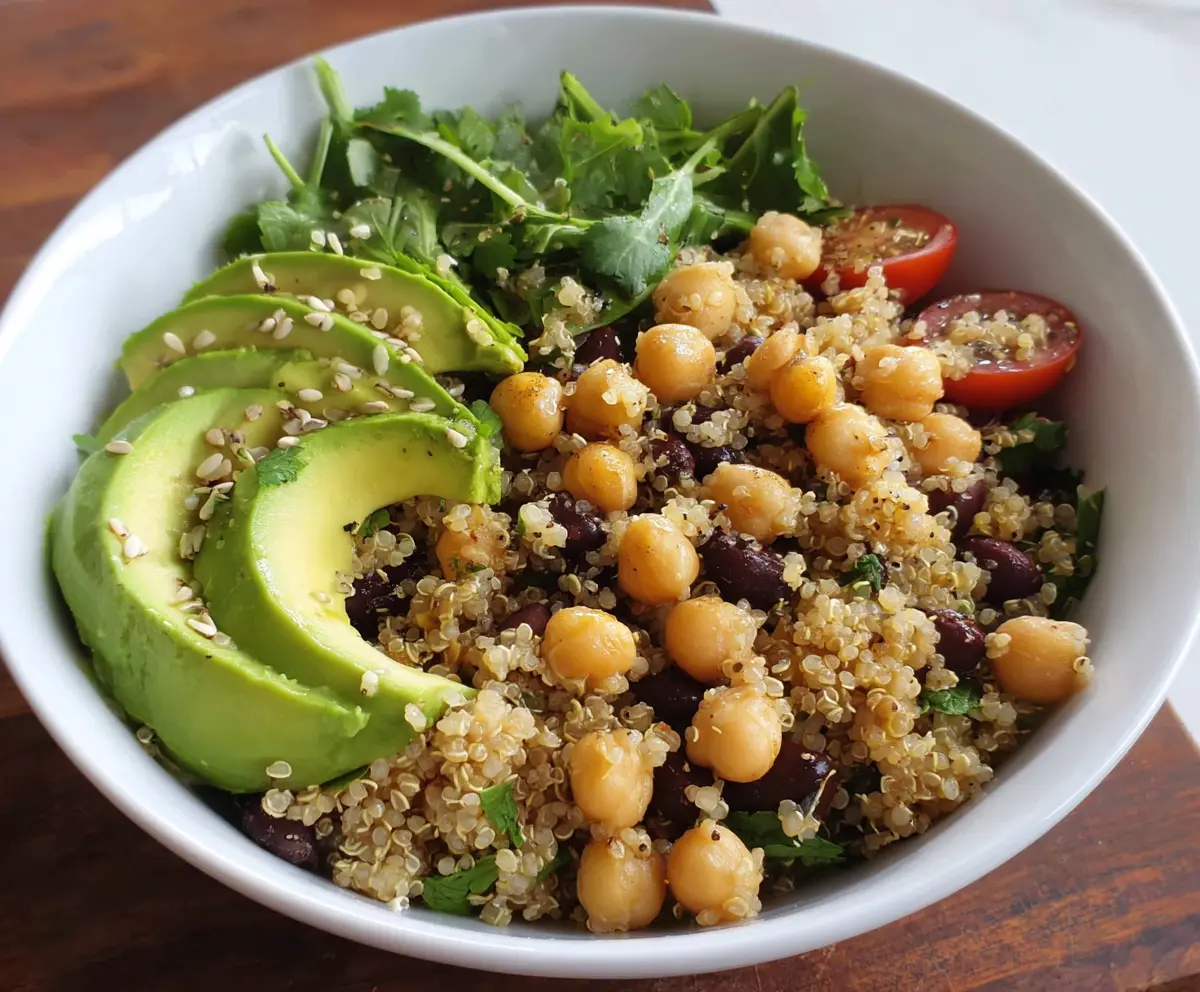 Healthy quinoa bowl with fresh avocado slices and chickpeas, perfect for a nutritious vegetarian meal.
