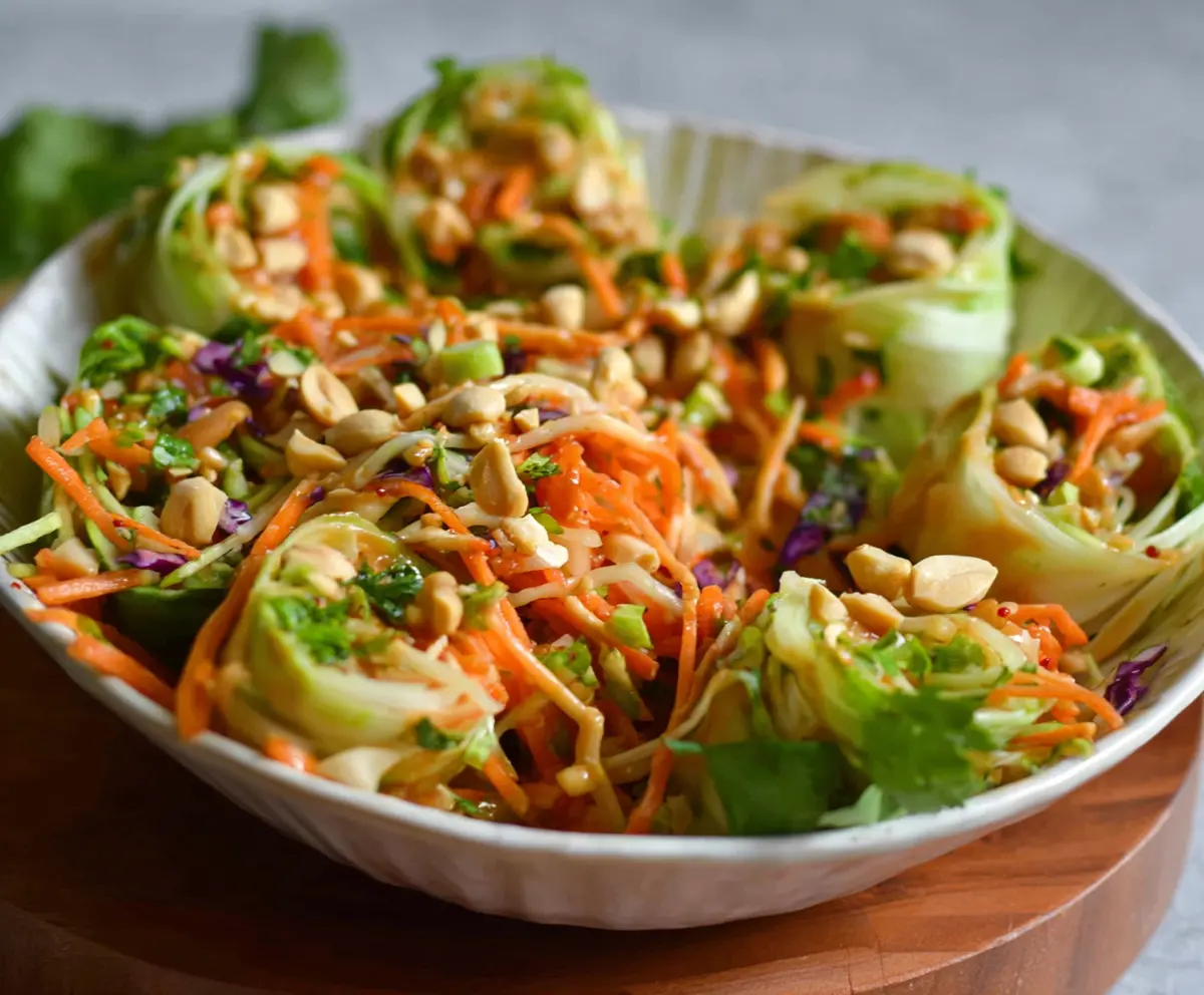 Fresh Spring Roll Salad with Peanut Sauce, featuring colorful vegetables and crunchy spring rolls.