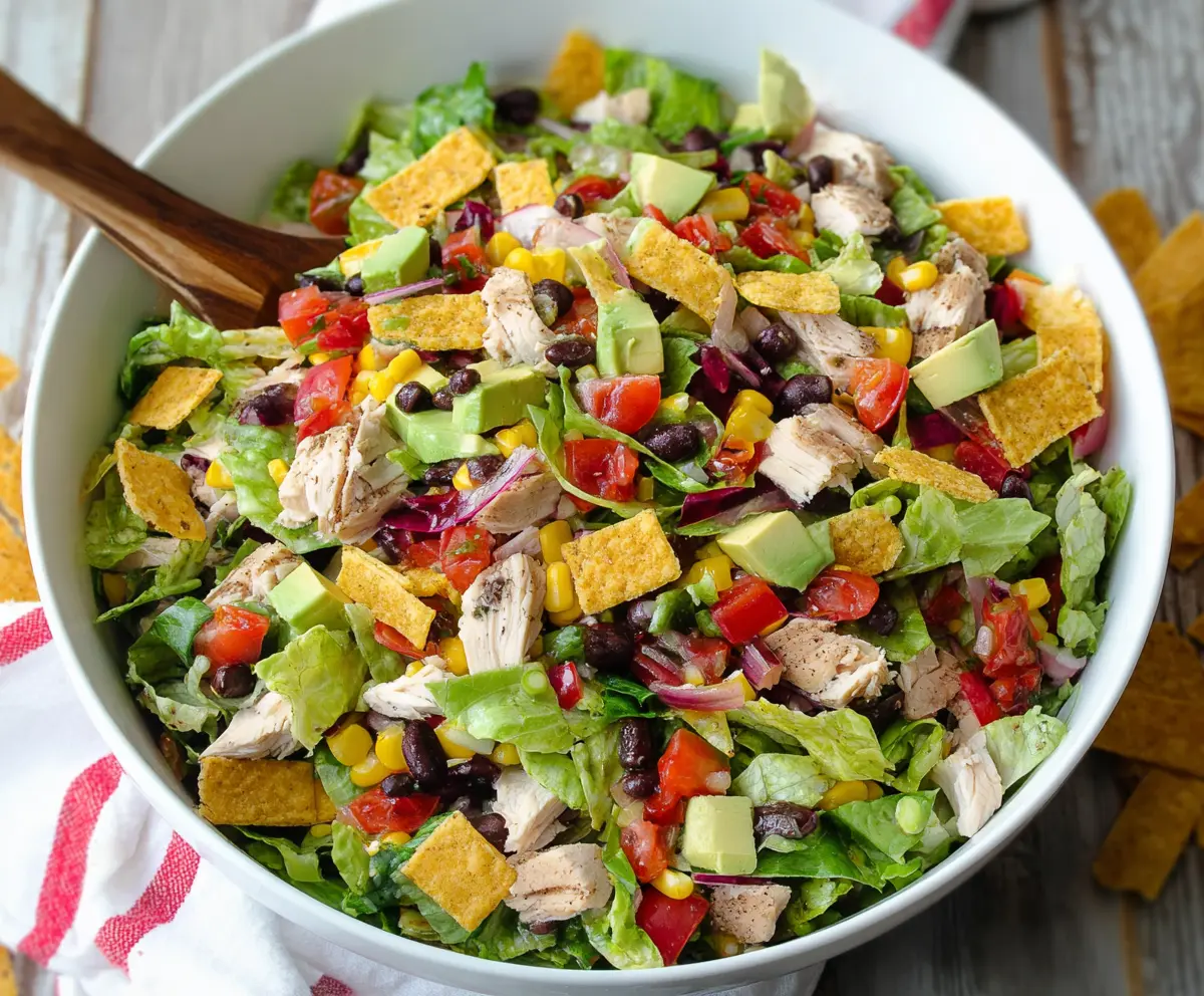 Fresh Tex-Mex chopped chicken salad with colorful vegetables and herbs, perfect for a healthy meal.